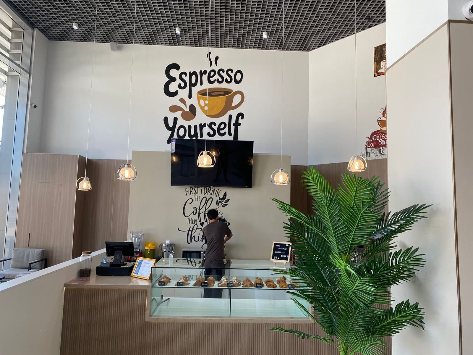 Inside a 7OZ Espresso café, with its coffee counter and pastry display